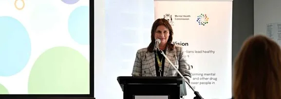 The Mental Health Commission Commissioner speaking at an event.