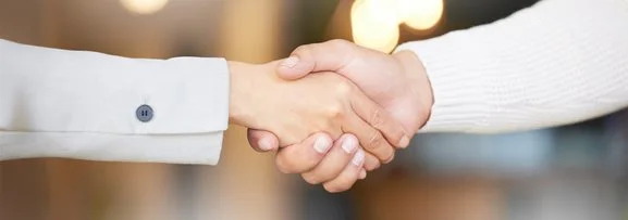 Hands shaking to show collaboration between organisations. 