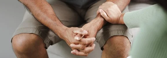Someone's arm being held in emotional support. 