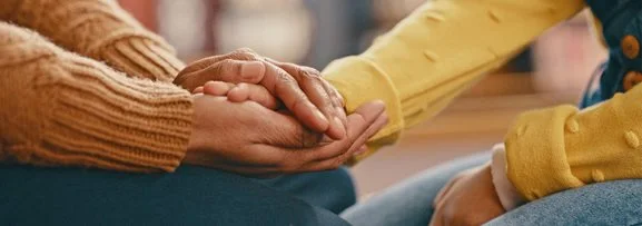 Someone's hand being held in support. 