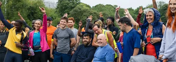 A group of diverse people, including different cultural backgrounds and disabilities. 
