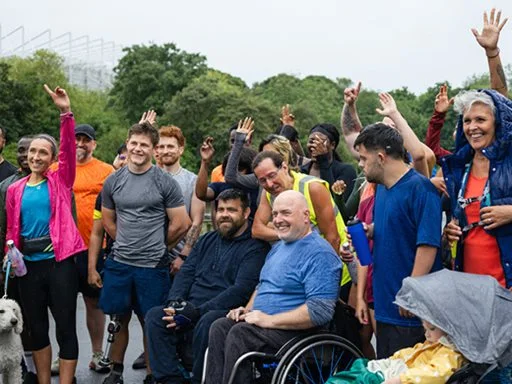 A group of diverse people, including different cultural backgrounds and disabilities. 