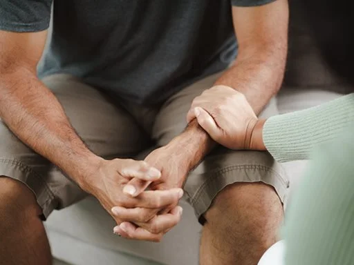 Someone's arm being held in emotional support. 