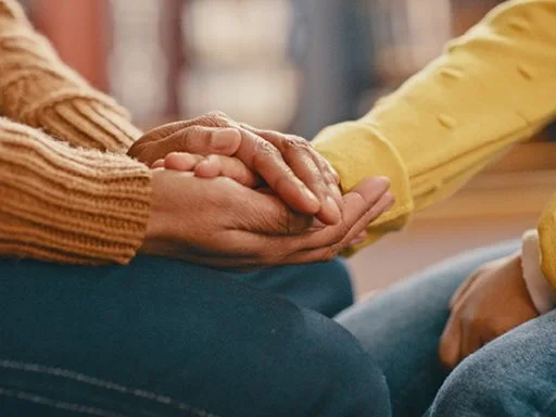 Someone's hand being held in support. 