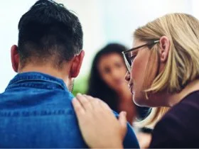 Woman putting hand on shoulder
