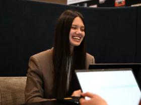 young graduate happy at work