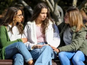 show of support from group of friends to someone struggling.