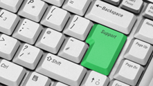 Computer keyboard with a green key labelled 'Support'