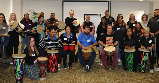 Participants at the workshop, with drums